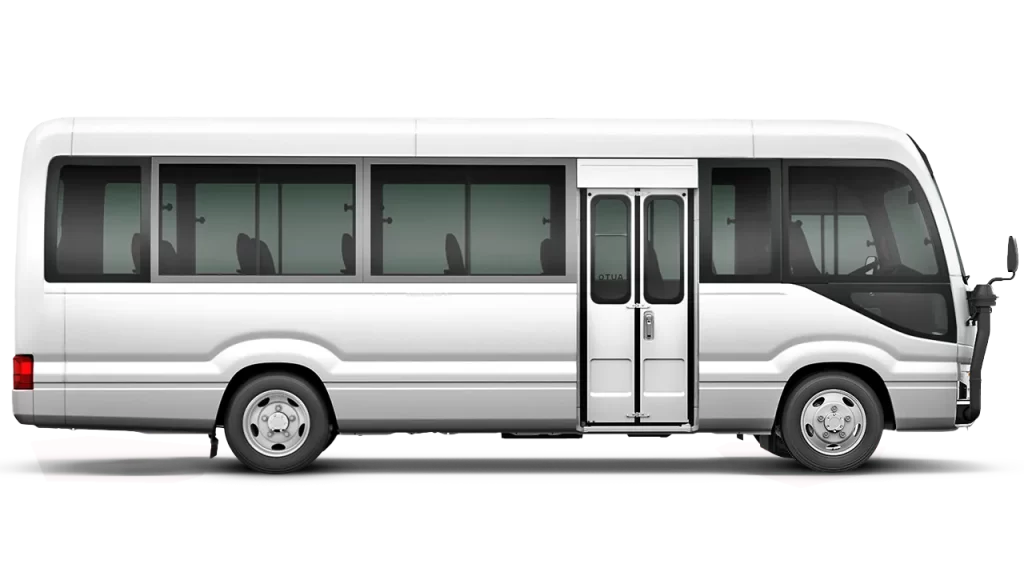 Toyota Coaster bus seating 18 passengers with ample luggage space, ideal for group travel.