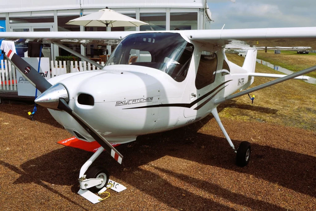 Cessna 162 Skycatcher parked outside, showcasing its sleek high-wing design and compact structure