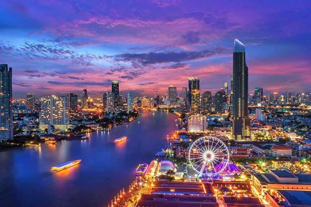 A stunning view of Bangkok cityscape with the Chao Phraya River and iconic temples in the background, showcasing the vibrant and cultural charm of the city.