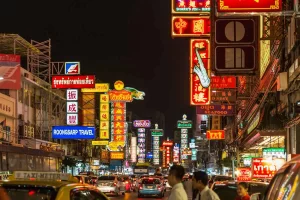 Yaowarat (Chinatown), a lively district in Bangkok filled with restaurants and dessert shops, offering authentic Thai-Chinese cuisine and a colorful nighttime atmosphere.