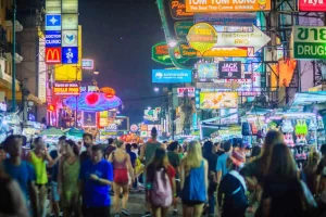 Khao San Road, a vibrant street in Bangkok filled with lively crowds, Thai food stalls, and live music, perfect for an exciting night out.