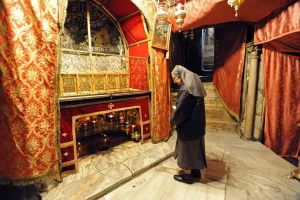 The Grotto of the Nativity, marked by a silver star with 14 points, in Bethlehem