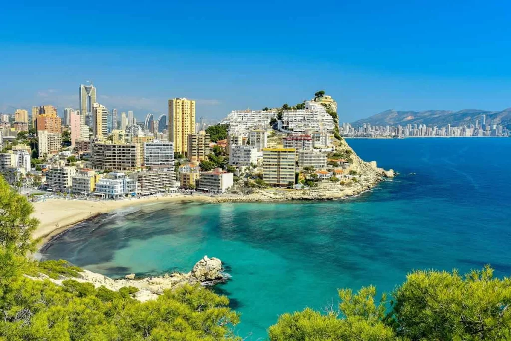 Tourists enjoying the sunny weather on Levante Beach, one of Benidorm’s most popular spots