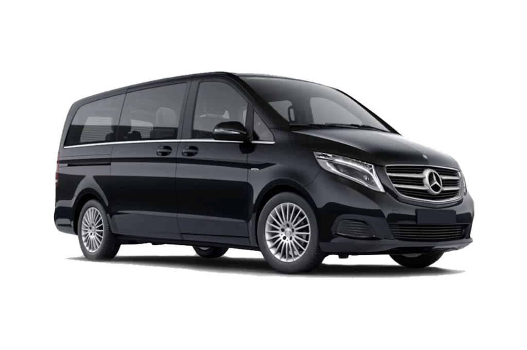 Luxury Mercedes Benz V-Class chauffeured car rental parked outside a five-star hotel