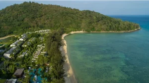 A luxurious beachfront villa at Rosewood Phuket, featuring eco-conscious design and an infinity pool overlooking Emerald Bay