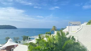 A stunning beachfront resort at The Nai Harn Phuket, featuring ocean-view terraces and direct beach access