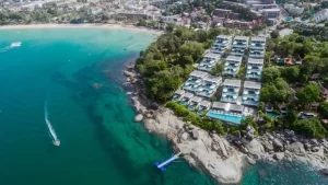 A luxurious oceanfront villa at Kata Rocks Phuket, featuring modern minimalist design and a private infinity pool