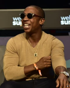 Ja Rule, the American rapper, singer, and actor, smiling during a public event