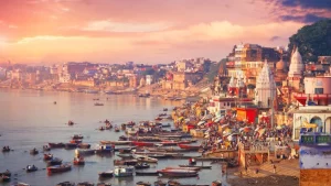 The city of Varanasi along the Ganges River, bustling with boats and pilgrims at sunrise