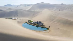 Crescent Lake, an oasis in the Gobi Desert near Dunhuang, surrounded by vast sand dunes