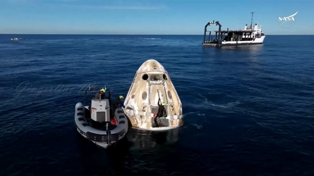 SpaceX Crew Dragon capsule floating in the Atlantic after splashdown